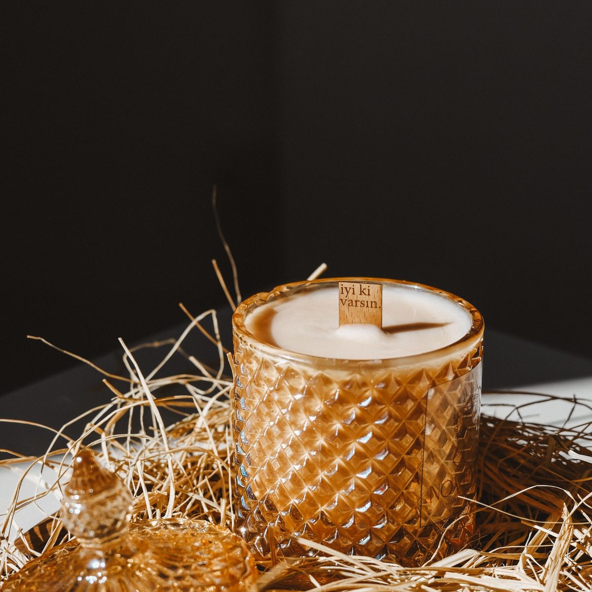 Linen candle in a glass jar